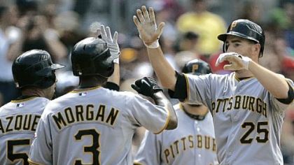 Adam LaRoche (25) is greeted by Nyjer Morgan and Ramon Vazquez after his three-run homer in the fifth inning against the Padres yesterday in San Diego. LaRoche also homered in the ninth inning.