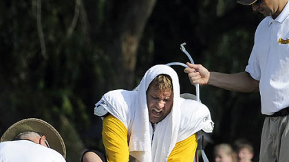 Steelers quarterback Ben Roethlisberger winces as he puts his right shoe back on near the end of practice last Thursday. Roethlisberger injured his right foot when tackle Max Starks fell on him during pass drills near the end of practice.