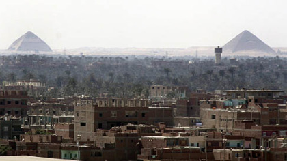 The densely inhabited landscape is seen around the Dahshur Pyramids near Cairo, Egypt.