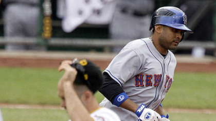 Mets' Fernando Tatis, right, rounds the bases past Pirates shortstop Jack Wilson after hitting a two-run homer in the sixth inning off Pirates pitcher Jeff Karstens yesterday.