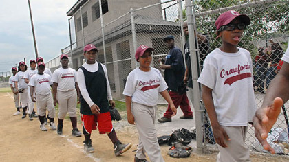The Pittsburgh Crawfords line up to shake hands with the New York Black Yankees after a game on Saturday at the refurbished Josh Gibson Field in the Hill District.