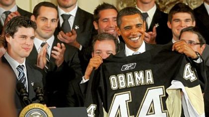 Penguins captain Sidney Crosby presents President Barack Obama with a jersey yesterday.