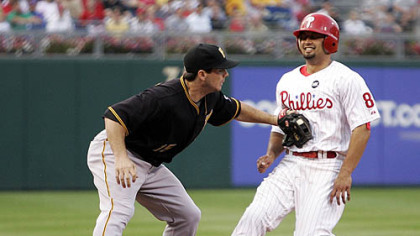 Pirates third baseman Andy LaRoche tags out Phillies outfielder Shane Victorino trying to steal third base in the first inning of last night's game.