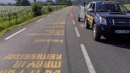 Chalkbot, a mobile robot sponsored by Nike and cyclist Lance Armstrong's Livestrong Foundation, prints messages on the pavement in front of cyclists competing now in the Tour de France.