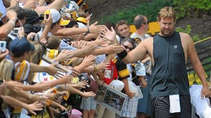Ben Roethlisberger, making his way to the Steelers trainig camp practice field, high fives fans along the way before afternoon sessions yesterday at St. Vincent College in Latrobe.