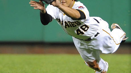 Pirates right fielder Delwtn Young makes a diving catch on ball hit by the Brewers infielder Craig Counsel.