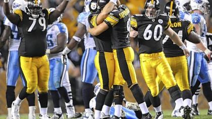 Steelers kicker Jeff Reed is congratulated by punter Daniel Sepulveda after kicking the winning field goal against the Titans in overtime last night at Heinz Field.
