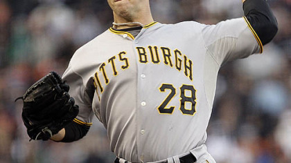 Pirates pitcher Paul Maholm pitches against the Giants during the first inning of last night's game in San Francisco.