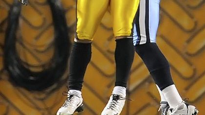 Steelers safety Troy Polamalu intercepts pass intended for Titans Kenny Britt in the first quarter during last night's game at Heinz Field. Polamalu left the game due to a knee injury in the second quarter and did not return.