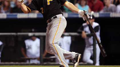 Pirates' shortstop Jack Wilson follows the flight of his solo home run against the Rockies in the seventh inning of last night's game.