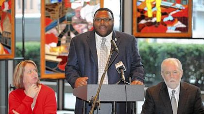 Jamaal Craig, vice president, Pittsburgh Chapter, Coalition of Black Trade Unionists, talks about the current economic crisis as Keli Vereb, member of UFCW Local 1408  and Jack Shea, President of Allegheny County Labor Council listen at the United Steelworkers building.