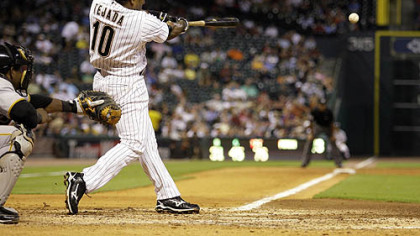 Astros shortstop Miguel Tejada hits a two-run double during the fifth inning of last night's game. Pitcher Mike Hampton and outfielder Michael Bourn scored on the hit.