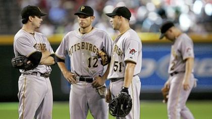 Pirates infielders Andy LaRoche, Freddy Sanchez and Steve Pearce talk things over during a pitching change in the eighth inning of yesterday's game against the Arizona Diamondbacks in Phoenix. At right is shortstop Jack Wilson.