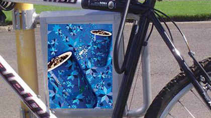 An example of a bicycle rack with an advertising panel developed by the San Diego firm BicyclePark Media.