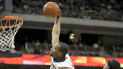 Sam Young soars in for a windmill dunk -- two of his 18 points -- in Pitt's victory at the Petersen Events Center.