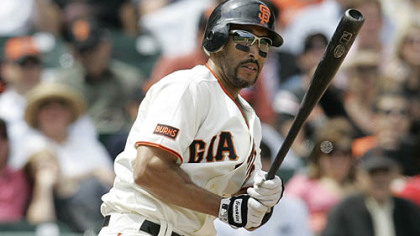 Giants outfielder Randy Winn lines an RBI single down the first base line with two outs off Pirates pitcher Matt Capps during the 10th inning.