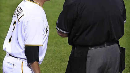 Pirates manager John Russell argues a no call when Nyger Morgan got hit by a pitch and home plate umpire Jerry Layne called it a strike in the 6th inning,June 25, 2009.
