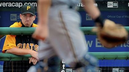 Former Pirates first baseman Adam LaRoche looks on as the Brewers make a pitching change.