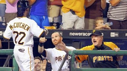 Andrew McCutchen is congratulated by Ryan Doumit and pitching coach Joe Kerrigan after hitting his third home run of the game in the sixth inning against the Nationals last night.