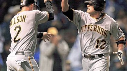 Freddy Sanchez, right, celebrates with Jack Wilson after hitting a two-run homer against the Cubs in the fourth inning last night in Chicago.