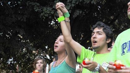 Singing an old Iranian folk song, Anahita Khojandi,23, a University of Pittsburgh student, left, and Arash Farsi,23, a Carnegie Mellon student, who both came from Iran to study here, join about 60 others in Market Square to support the protesters in Iran and for the third day (called Sevoom) after the death of Neda Agha-Soltan.