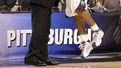 Pitt's Levance Fields jumps into head coach Jamie Dixon's arms during the final seconds of the Panthers' win tonight against Xavier in the NCAA East Regional in Boston.