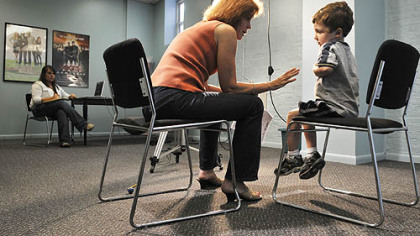 Ethan Davis, 5, of Mt. Lebanon, rehearses his lines with Donna Belajac during a casting call for the feature film "The Next Three Days," which is scheduled to shoot in Pittsburgh this fall. Dozens of  boys showed up at Ms. Belajac's casting agency on Market Street yesterday to audition for the roll of the 5-year-old son of Russell Crowe's character. At left is Missy Haught, an intern at the agency.