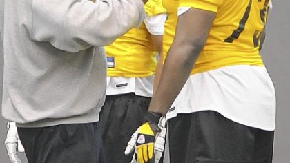 Steelers' number one draft pick Ziggy Hood (center) listens to instructions during minicamp workouts yesterday.