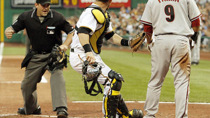 Pirates catcher Ryan Doumit looks as home plate umpire Brian Knight calls Diamondbacks outfielder Garardo Parra out after he tried to score from first base on a double by third baseman Mark Reynolds in the third inning inning.