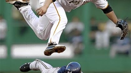 Pirates right fielder Delwyn Young makes a diving catch for an out on Diamondbacks first baseman Josh Whitesell in the fourth inning.