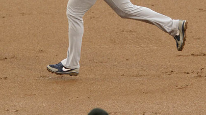 Cubs first baseman Derrek Lee rounds the bases behind Pirates pitcher Daniel McCutchen after hitting a two-run homerun during the third inning.