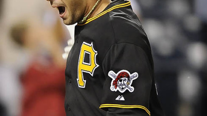 Garrett Jones celebrates at home after hitting a walk off home run in the 14th inning last night.