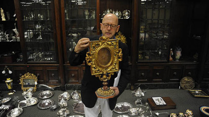 Graham Shearing with an 18th-century gilt gessoed reliquary frame that will be part of the auction.