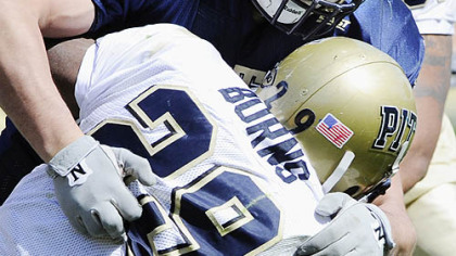 Pitt defender Nate Nix takes down running back Chris Burns in the Blue-Gold game yesterday.