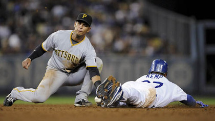 Dodgers outfielder Matt Kemp, right, steals second as Pirates shortstop Ronny Cedeno, left, is unable to hold on to the ball during the fifth inning.