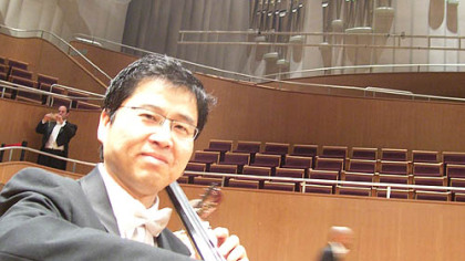 Chinese-born Pittsburgh Symphony Orchestra musician Adam Liu warms up at the Oriental Arts Center, Shanghai.