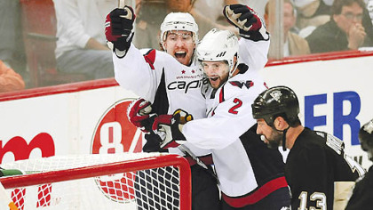 Capitals forward Tomas Fleischmann celebrates his goal with teammate Brian Pothier in the second period Monday night.