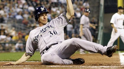 Brewers infielder Craig Counsell scores on a seventh-inning RBI single by first baseman Prince Fielder.