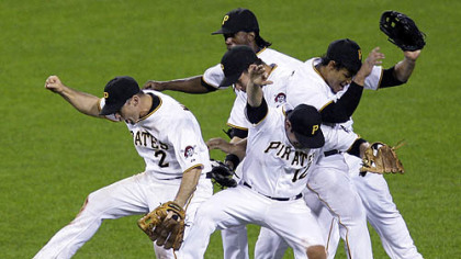 Pirates shortstop Jack Wilson (2), second baseman Freddy Sanchez, center front and outfielders Delwyn Young, right, Garrett Jones, center middle, and Andrew McCutchen, center rear, celebrate after an 8-5 home win last night.