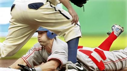 Kansas City's Willie Bloomquist slides into third with a triple in the first inning last night at PNC Park. He would score the first run on a single by Billy Butler.