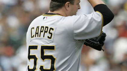 Pirates relief pitcher Matt Capps walks back to the mound after giving up a single to the Giants second baseman Eugenio Velez in the 10th inning.
