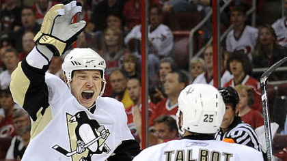 Ruslan Fedotenko celebrates his first-period goal with Max Talbot against the Hurricanes last night at the RBC Center in Raleigh, N.C.