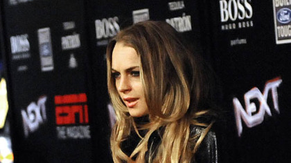 Lindsay Lohan walks the red carpet for the ESPN The Magazine Party Friday night in Tampa.