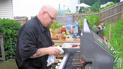 Greg Givan of Cranberry grills crocodile, alligator, kangaroo, elk and spiced llama sliders.