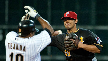 Pirates second baseman Delwyn Young throws to first base after forcing out Astros shortstop Miguel Tejada during the fourth inning.