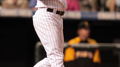 Colorado's Todd Helton follows the flight of his two-run, walk off home run against the Pirates in the ninth inning last night in Denver.