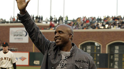 Former Giants and Pirates left fielder Barry Bonds waves to fans after a pre-game tribute to Sue Burns, a part owner of the Giants and friend of Bonds who lost her fight with cancer.