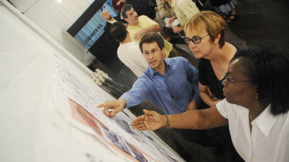 From left, Greg George, designer; Joan Kimmel, and the Rev. Le Saunders talk about discussing the creation of a community master plan for the Central Northside during a meeting on June 17, 2009 at the Mattress Factory