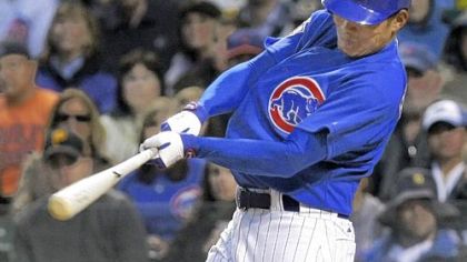 The Cubs' Kosuke Fukudome hits a solo home run against the Pirates in first inning last night in Chicago.