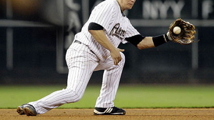 Astros third baseman Geoff Blum fields a ground ball hit by Pirates outfielder Delwyn Young during the fourth inning of last night's game. Young was out at first base on the play.